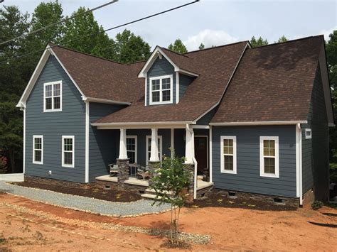 house with metal brown roof|gray houses with brown roofs.